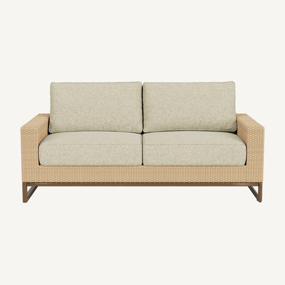 Beige outdoor sofa with wicker frame on a white background