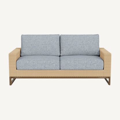 Two-seater outdoor sofa with light gray cushions and a wicker frame on a white background