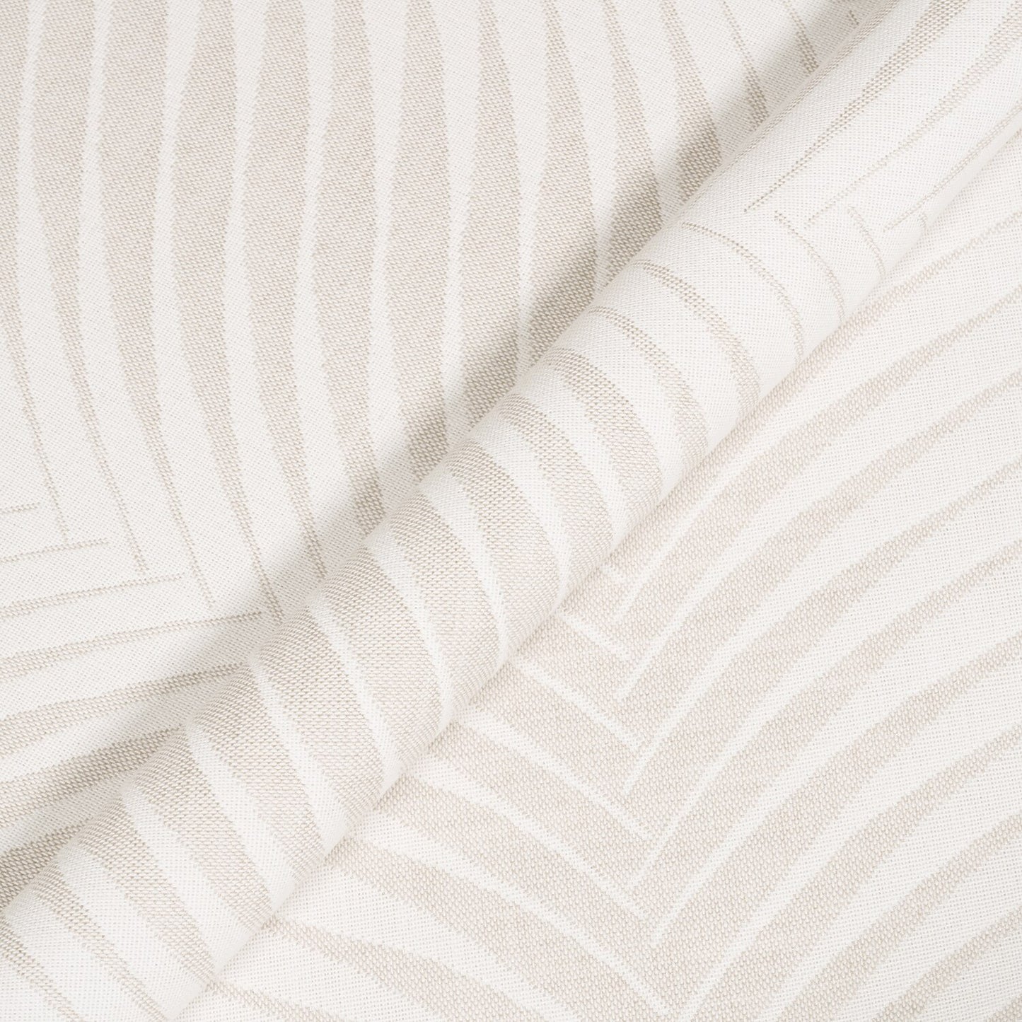 Close-up of textured white fabric with subtle patterns
