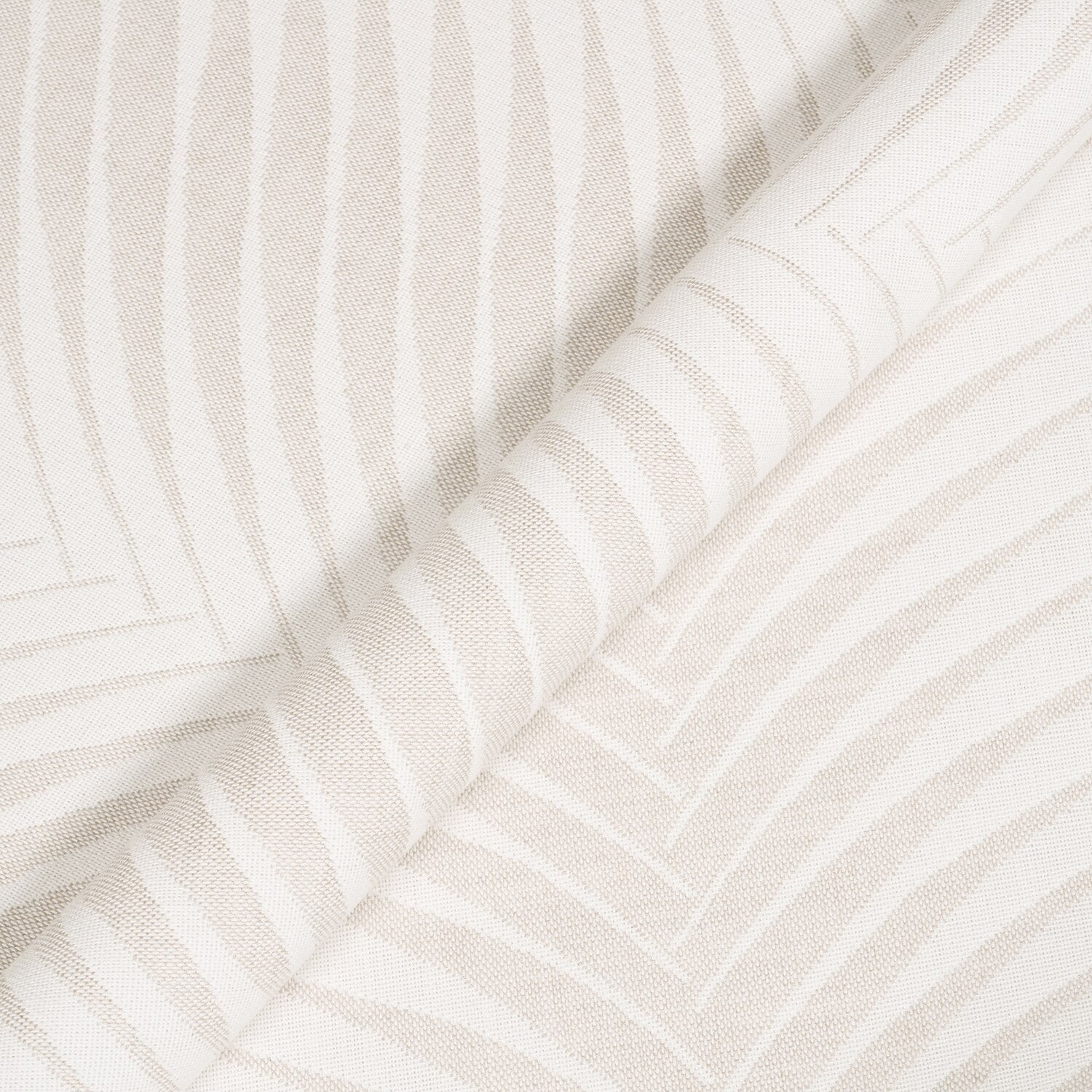 Close-up of textured white fabric with subtle patterns