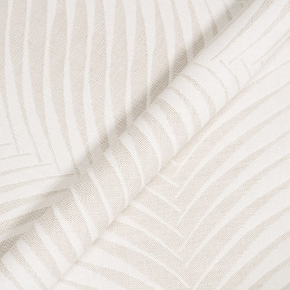 Close-up of textured white fabric with subtle patterns