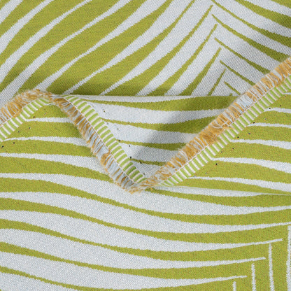 Close-up of green and white striped fabric with a zigzag pattern