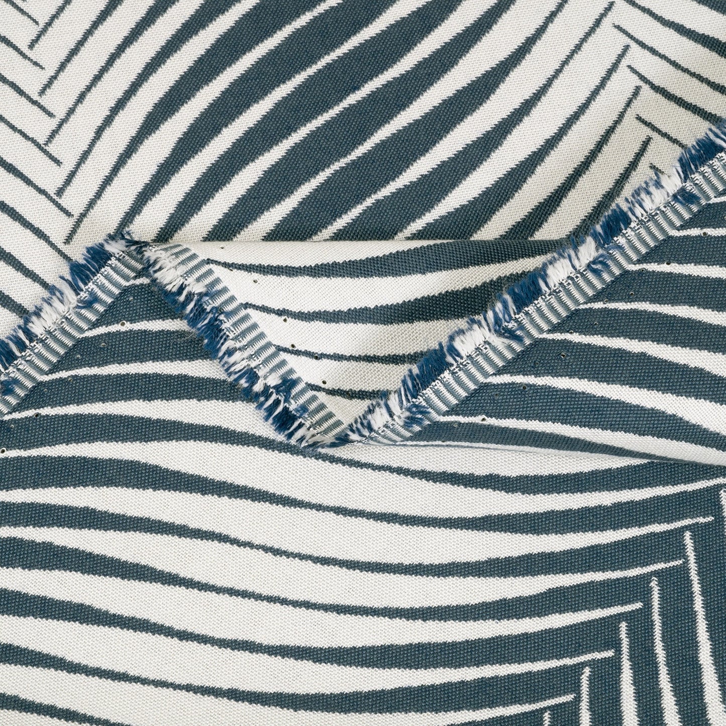 Close-up of fabric with blue and white striped pattern