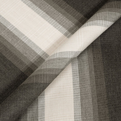 Close-up of woven fabric with a geometric pattern in black, white, and gray.