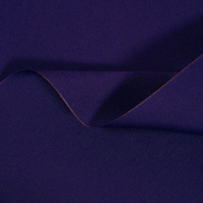 Navy blue fabric with a slight texture and fold