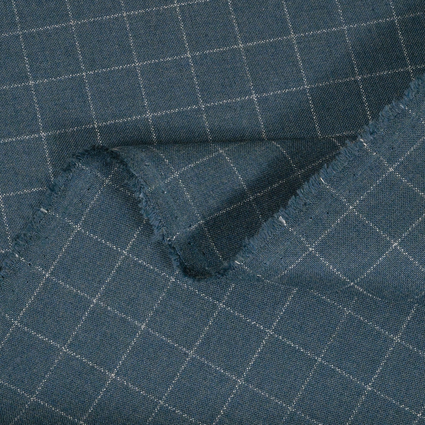 Close-up of blue checkered fabric with a grid pattern