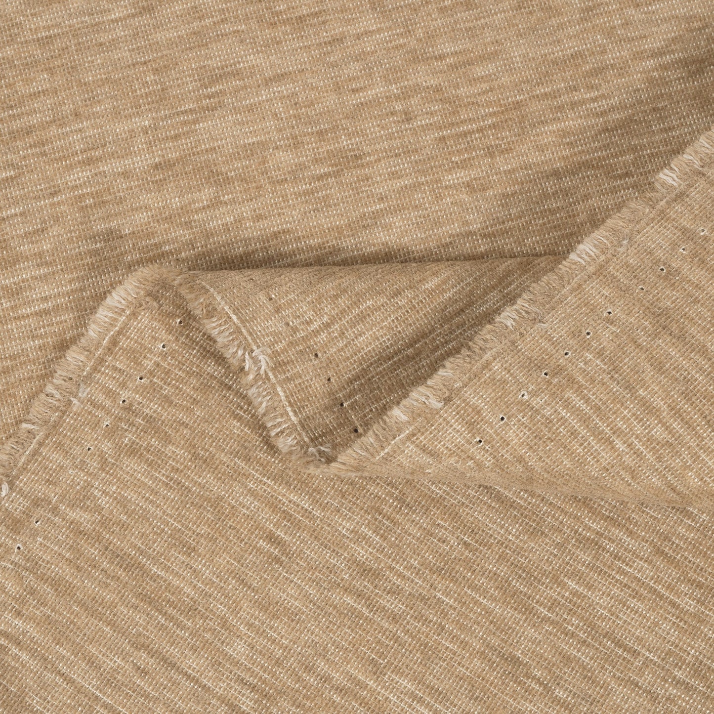 Close-up of beige fabric with a subtle pattern