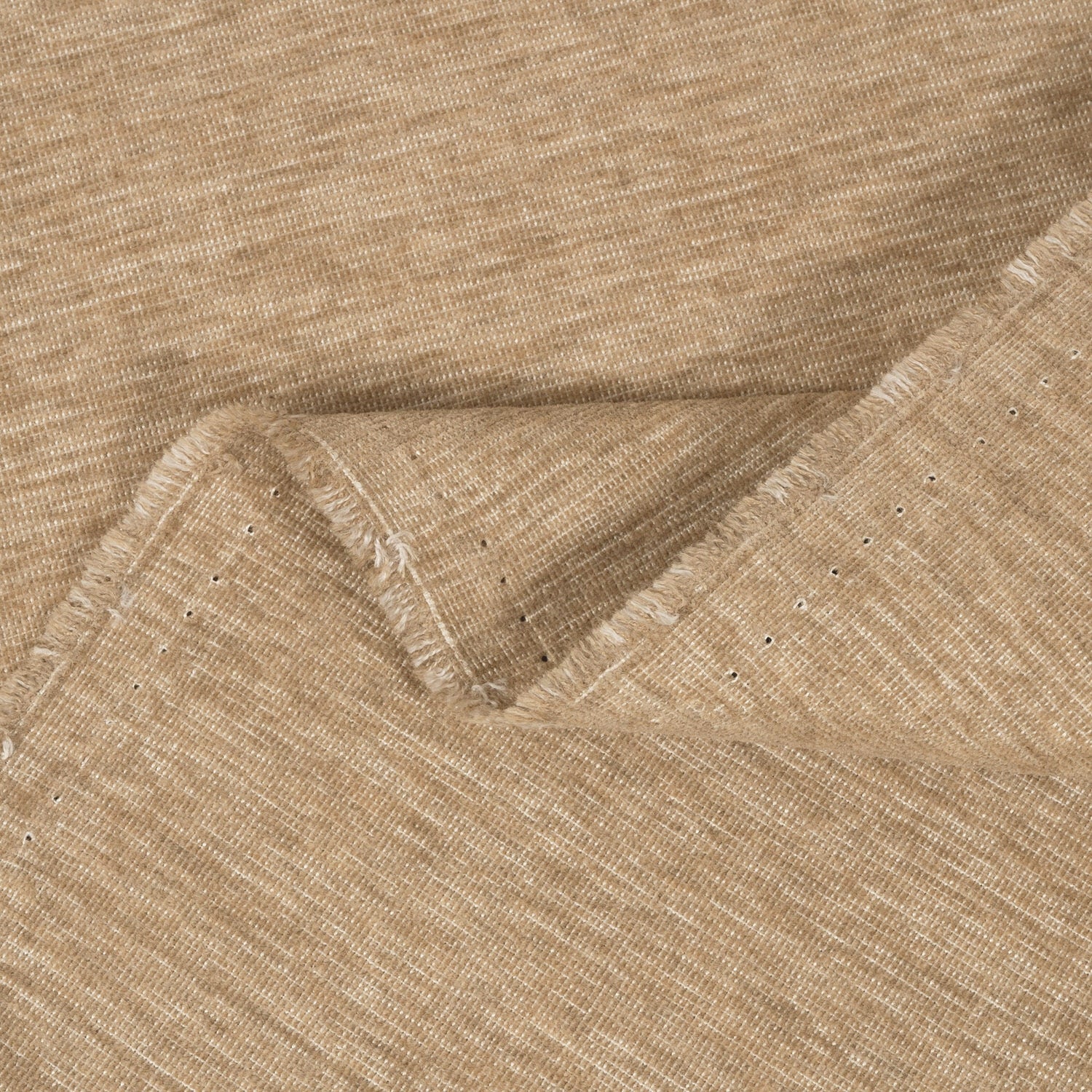 Close-up of beige fabric with a subtle pattern