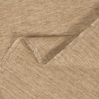 Close-up of beige fabric with a subtle pattern