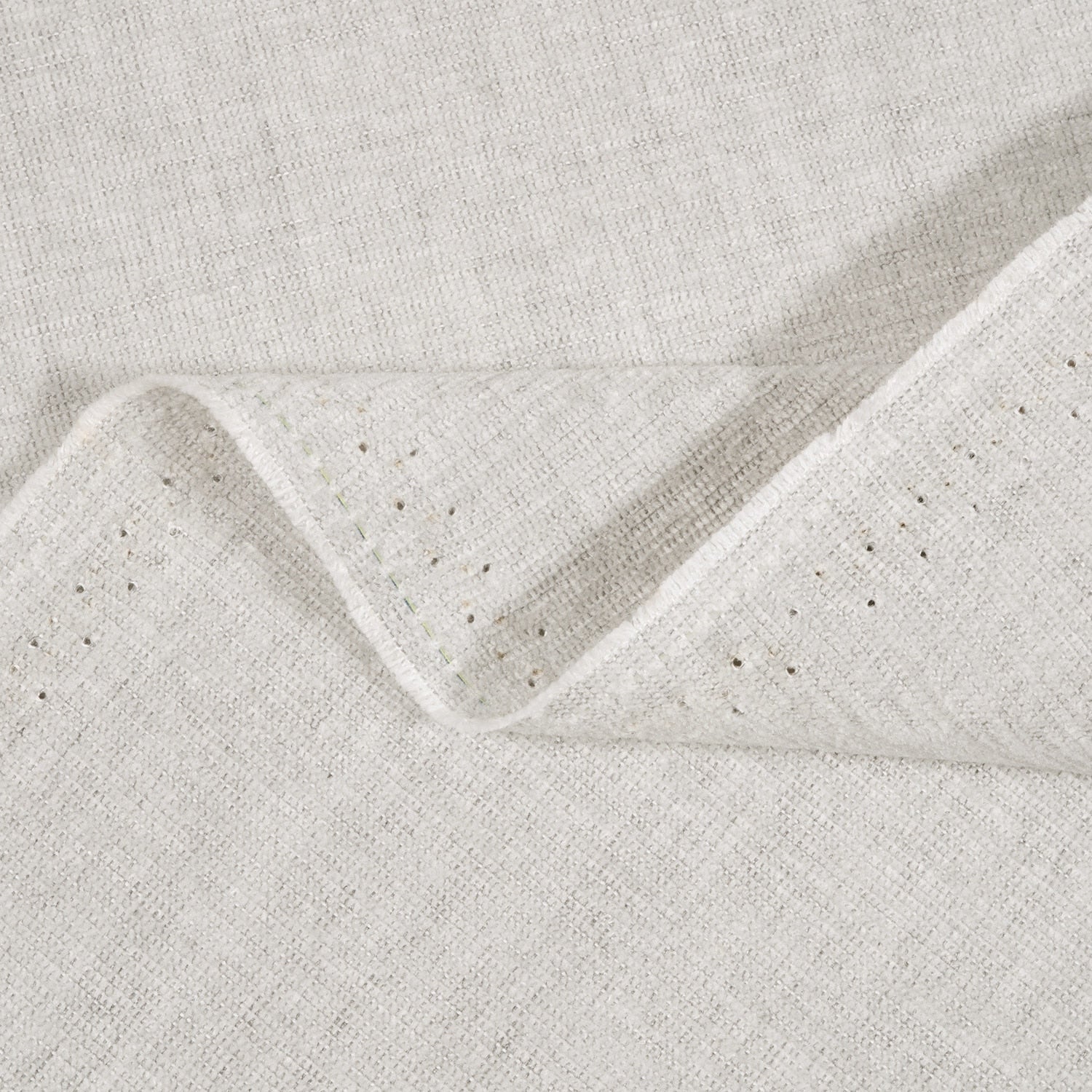 Close-up of textured light gray fabric with a subtle pattern