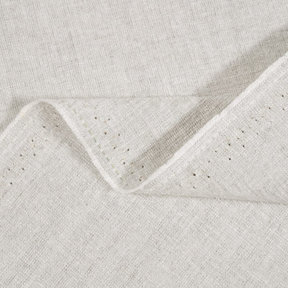 Close-up of textured light gray fabric with a subtle pattern