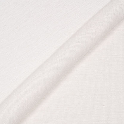 Close-up of white fabric with a subtle pattern