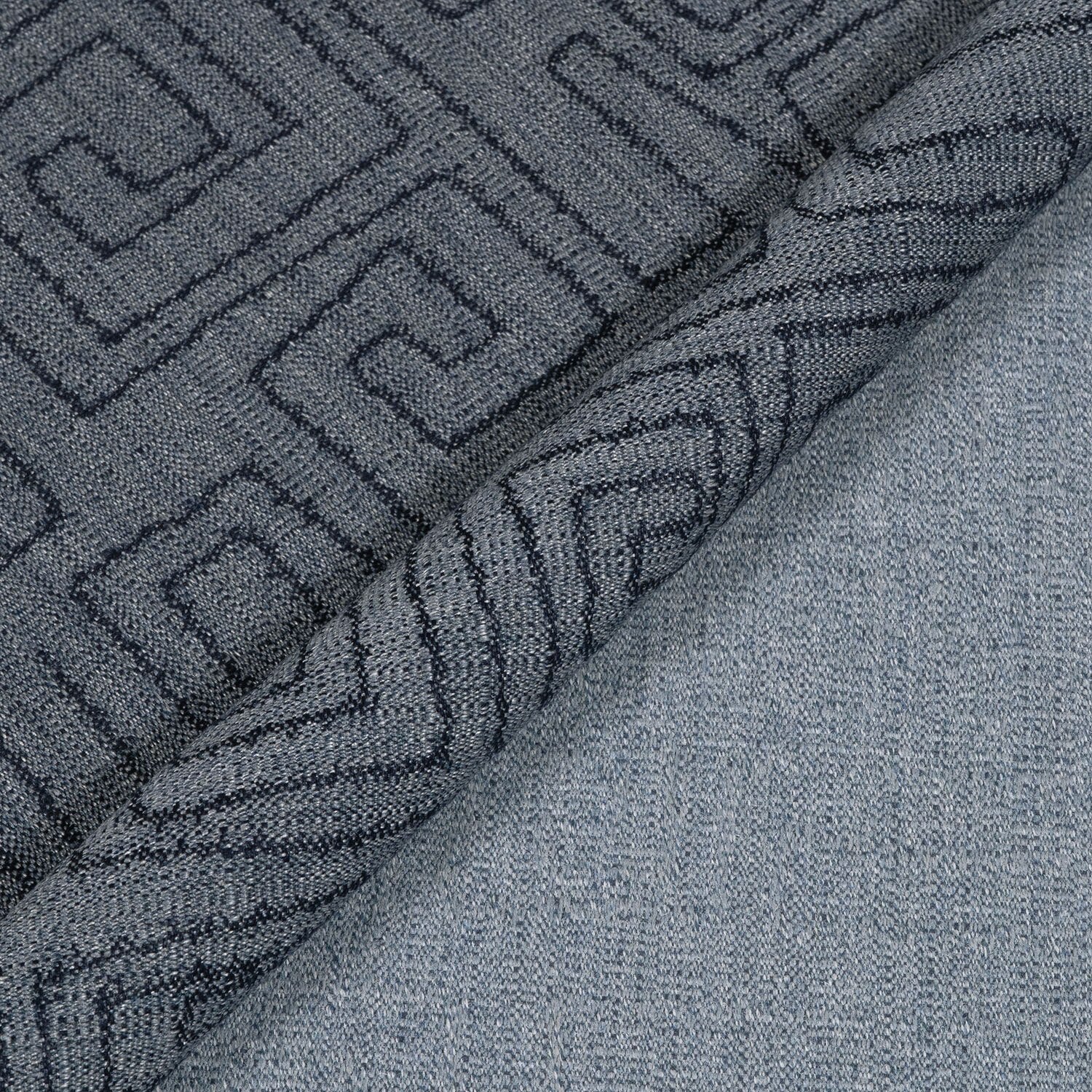 Close-up of textured gray fabric with geometric pattern