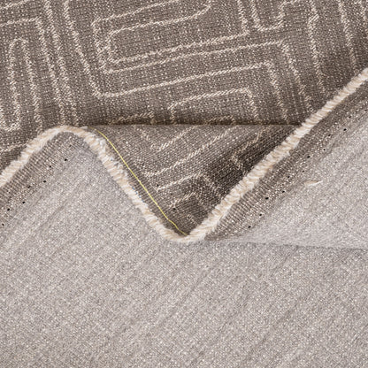 Close-up of a textured gray rug with geometric pattern