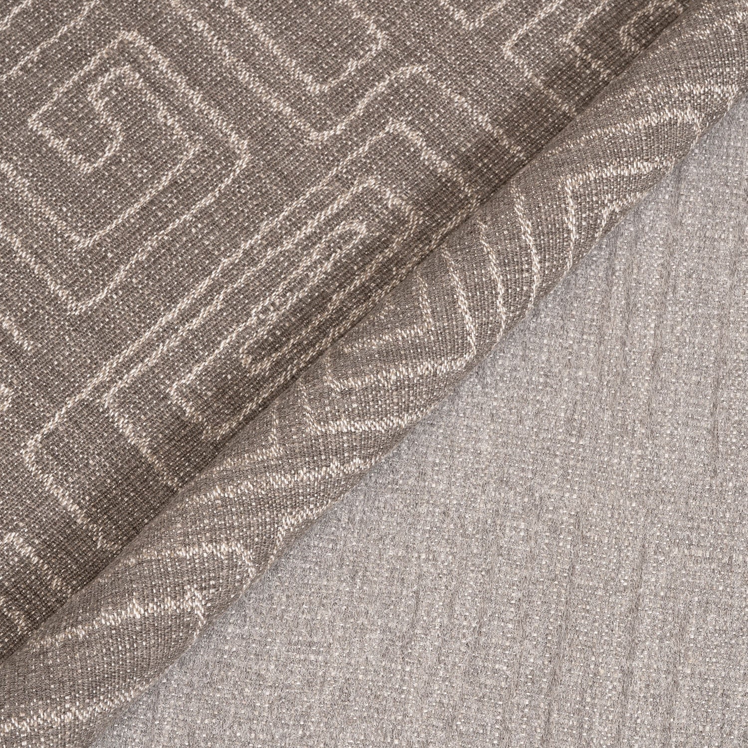 Textured fabric with a geometric pattern in shades of brown and gray.