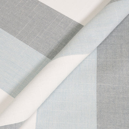Close-up of fabric swatches in gray, white, and light blue on a white background