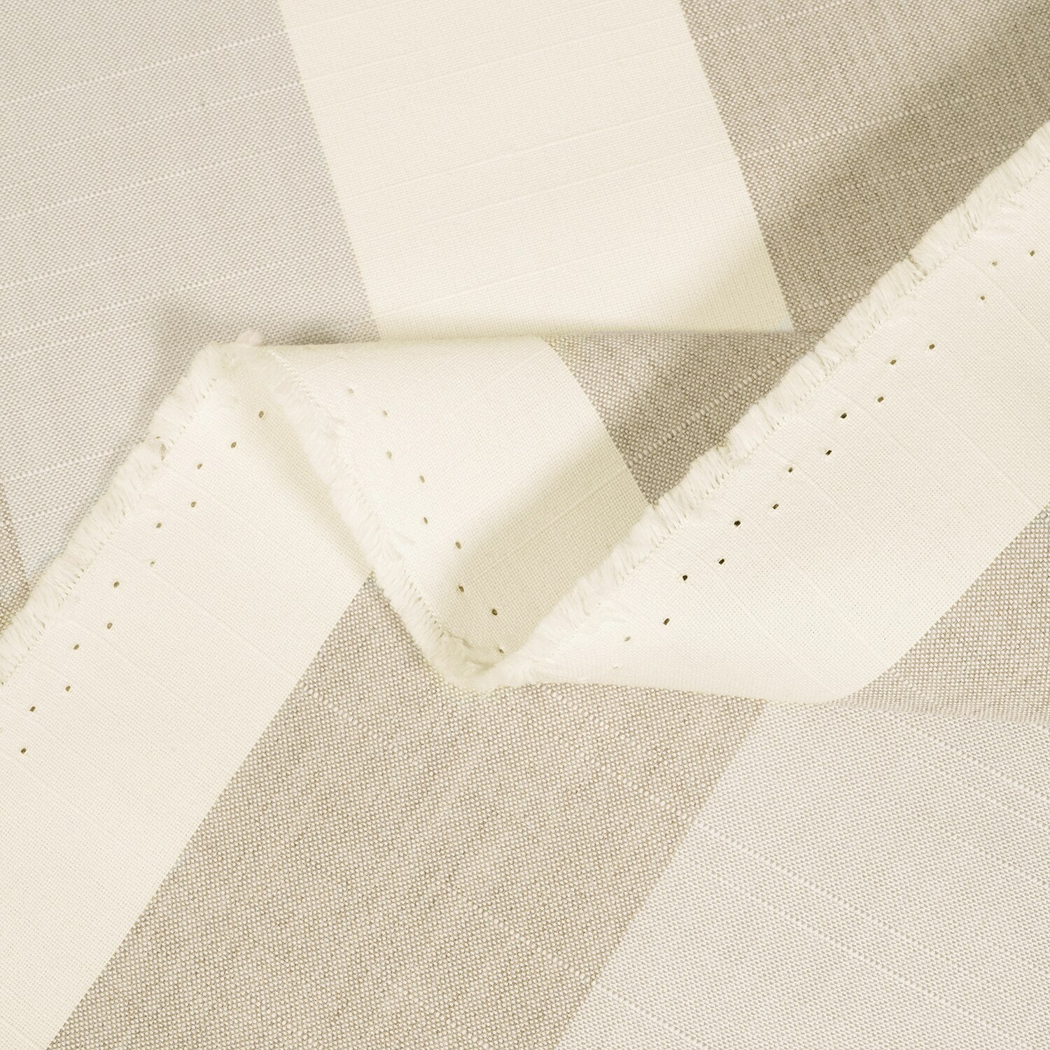 Close-up of beige and white fabric with a diamond pattern