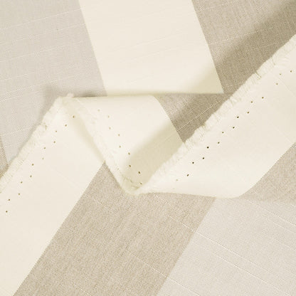 Close-up of beige and white fabric with a diamond pattern
