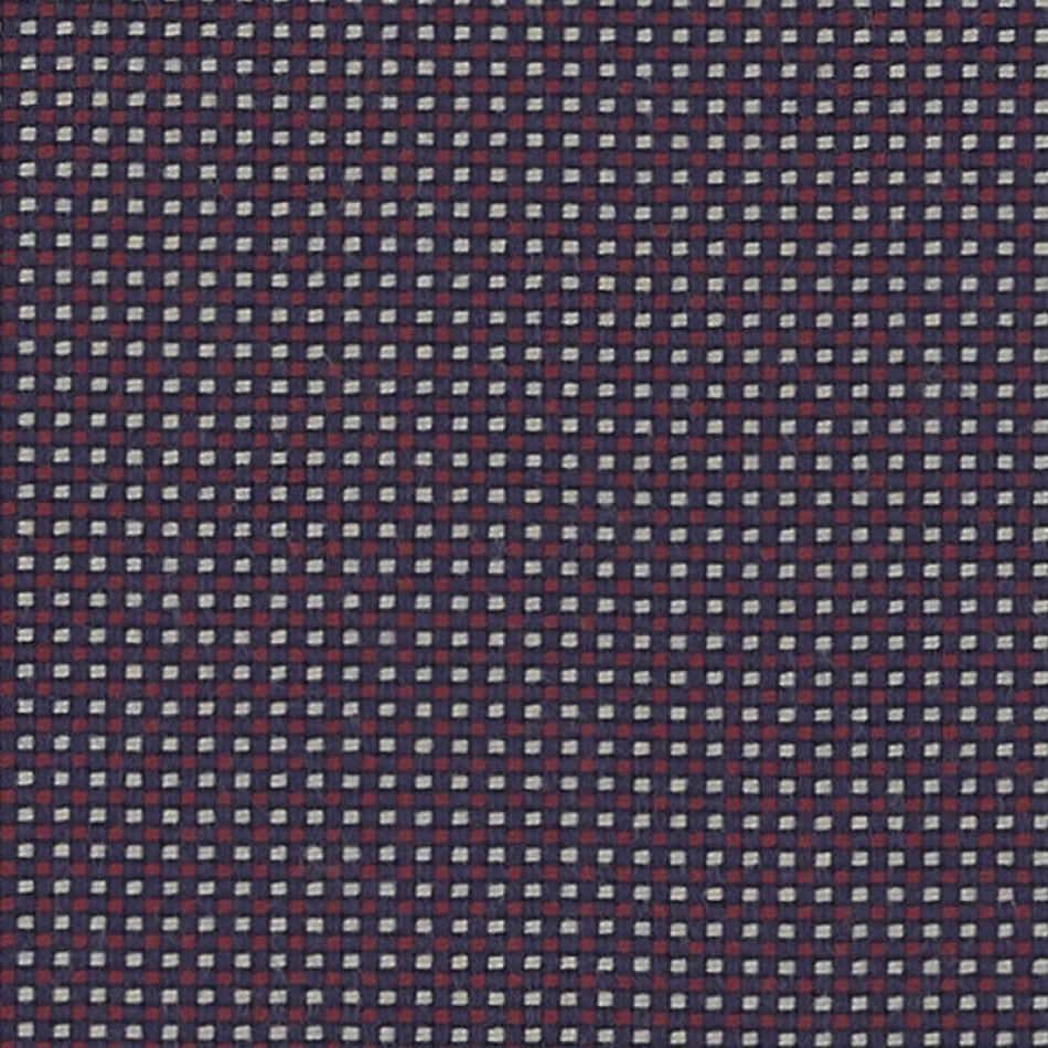 Close-up view of a multicolored fabric with a geometric grid pattern.