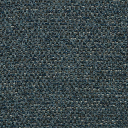 A close-up view of a textured blue fabric with a shibori pattern.