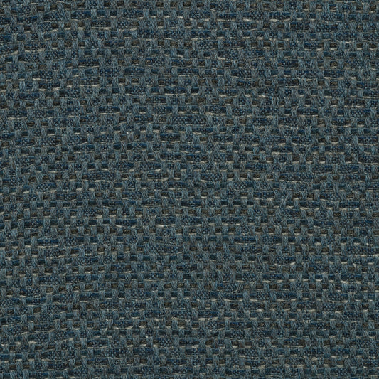 A close-up view of a textured blue fabric with a shibori pattern.