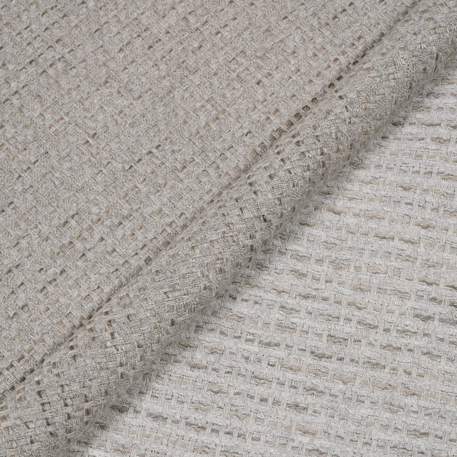 Close-up of textured beige fabric with a subtle pattern