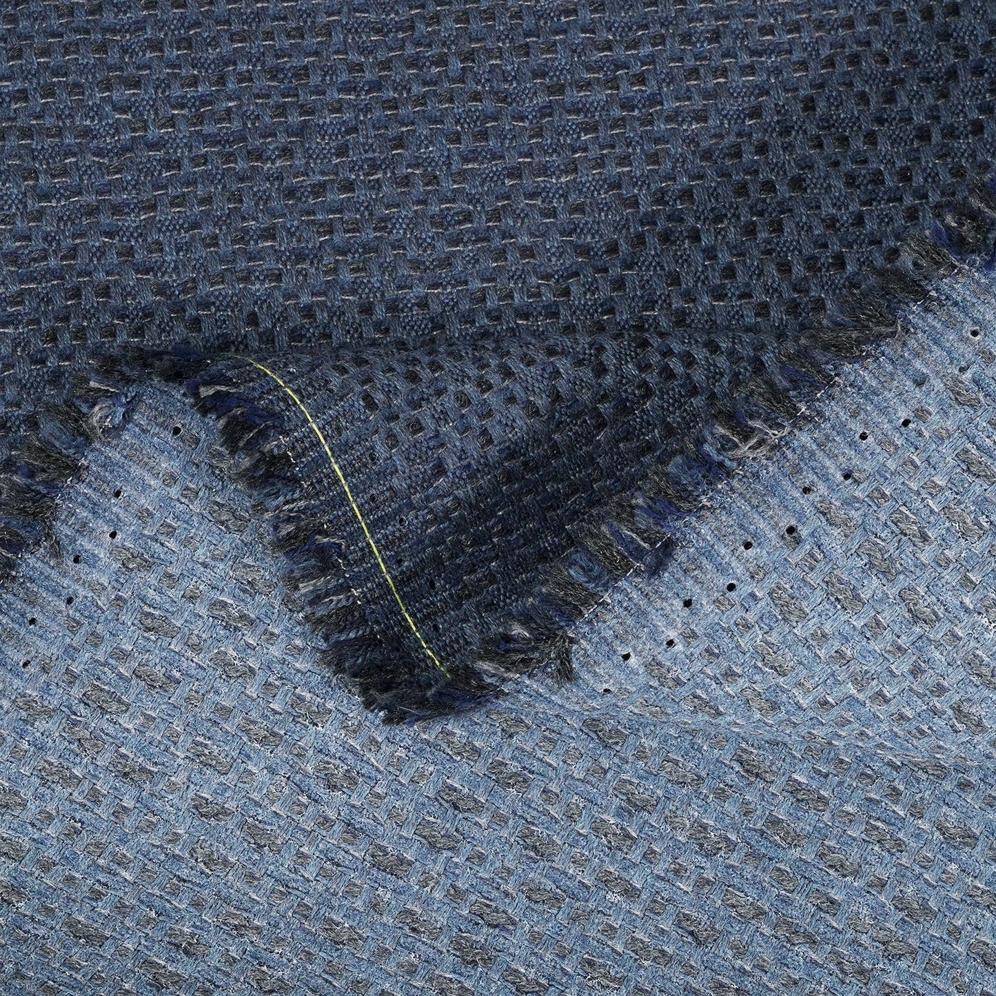 Close-up of textured blue fabric with a pattern
