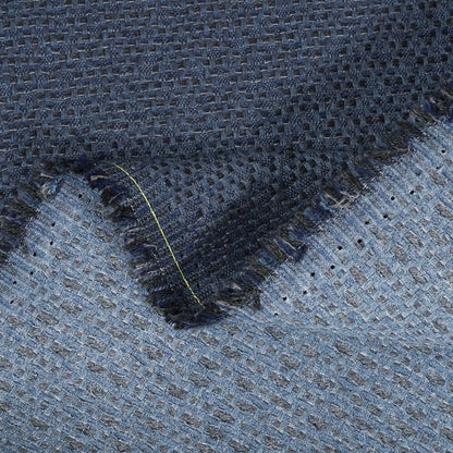 Close-up of textured blue fabric with a pattern