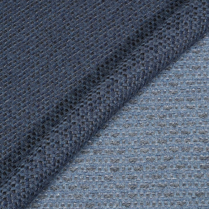 Close-up of textured blue fabric with a subtle pattern