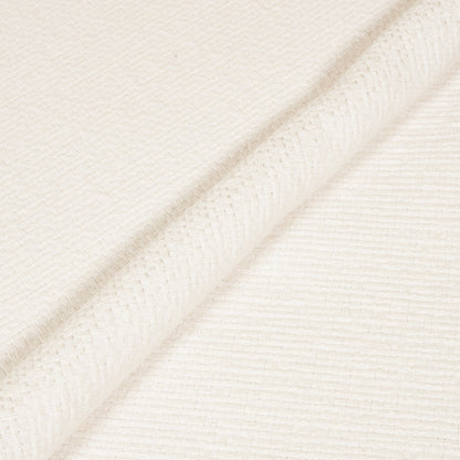 Close-up of a textured white fabric with diagonal lines
