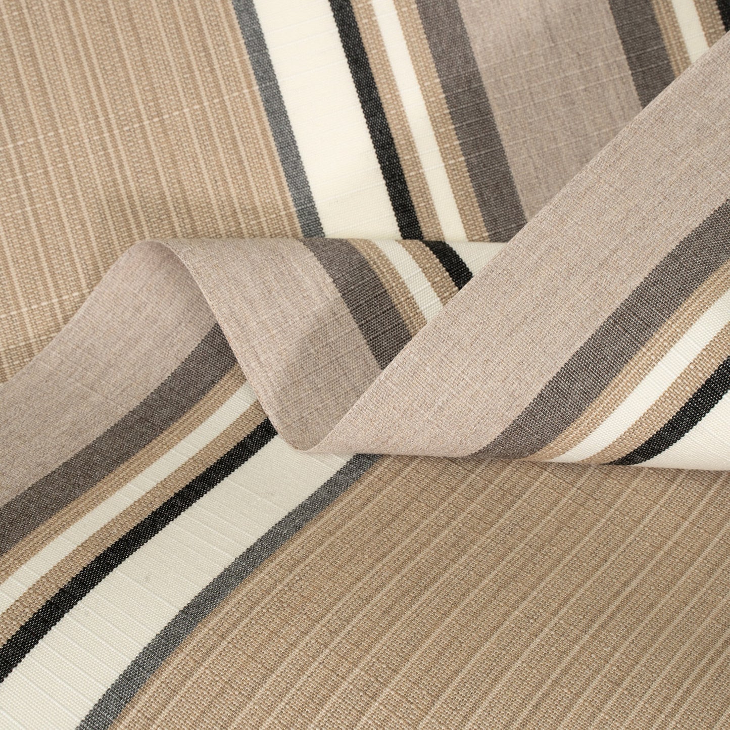 Close-up of striped fabric with brown, beige, and black colors.