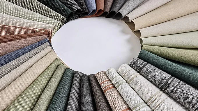 Circular arrangement of fabric swatches in various colors and textures.