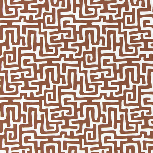 Patterned fabric with maze-like design on a brown background