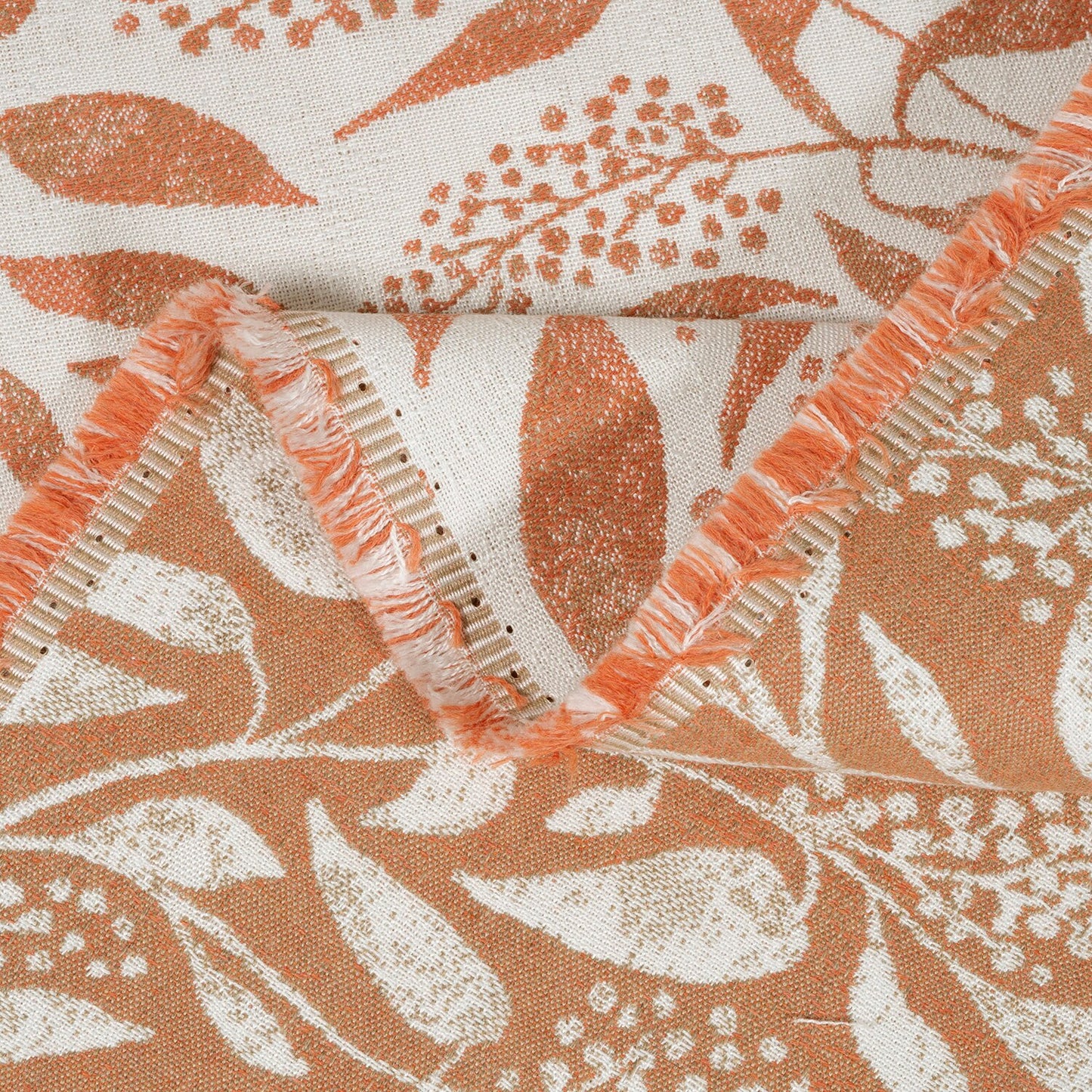 Close-up of fabric with floral pattern and decorative trim