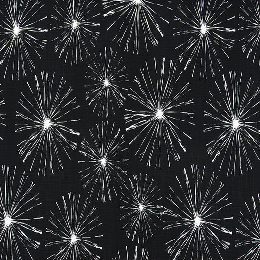 A fabric with a black background featuring a white fireworks pattern.