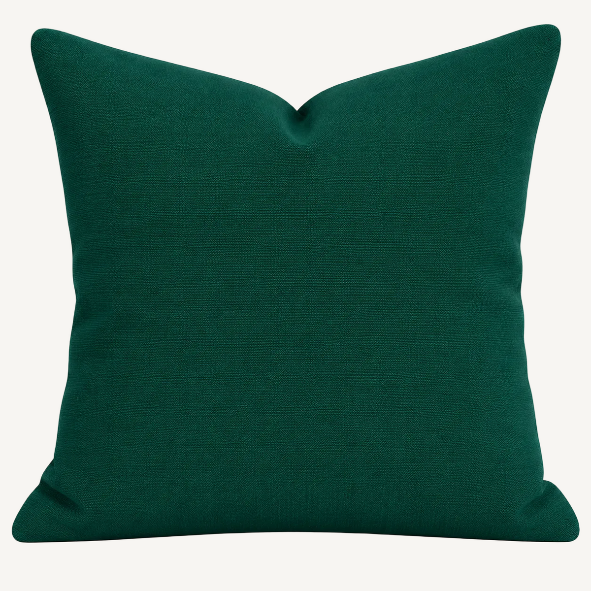 A square throw pillow in a deep emerald green fabric, shown against a plain white background.