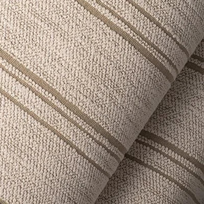 Close-up of beige fabric with brown stripes