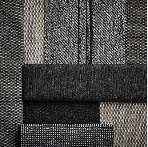 Close-up of textured black and gray fabric swatches