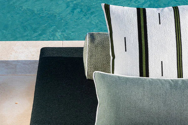 Textured outdoor cushions by a poolside