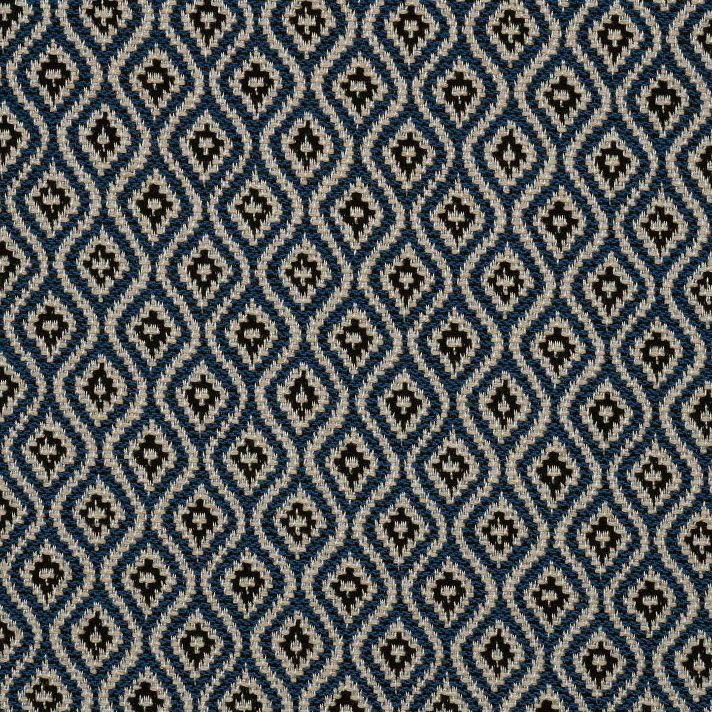 Patterned fabric with a geometric design in blue and beige.