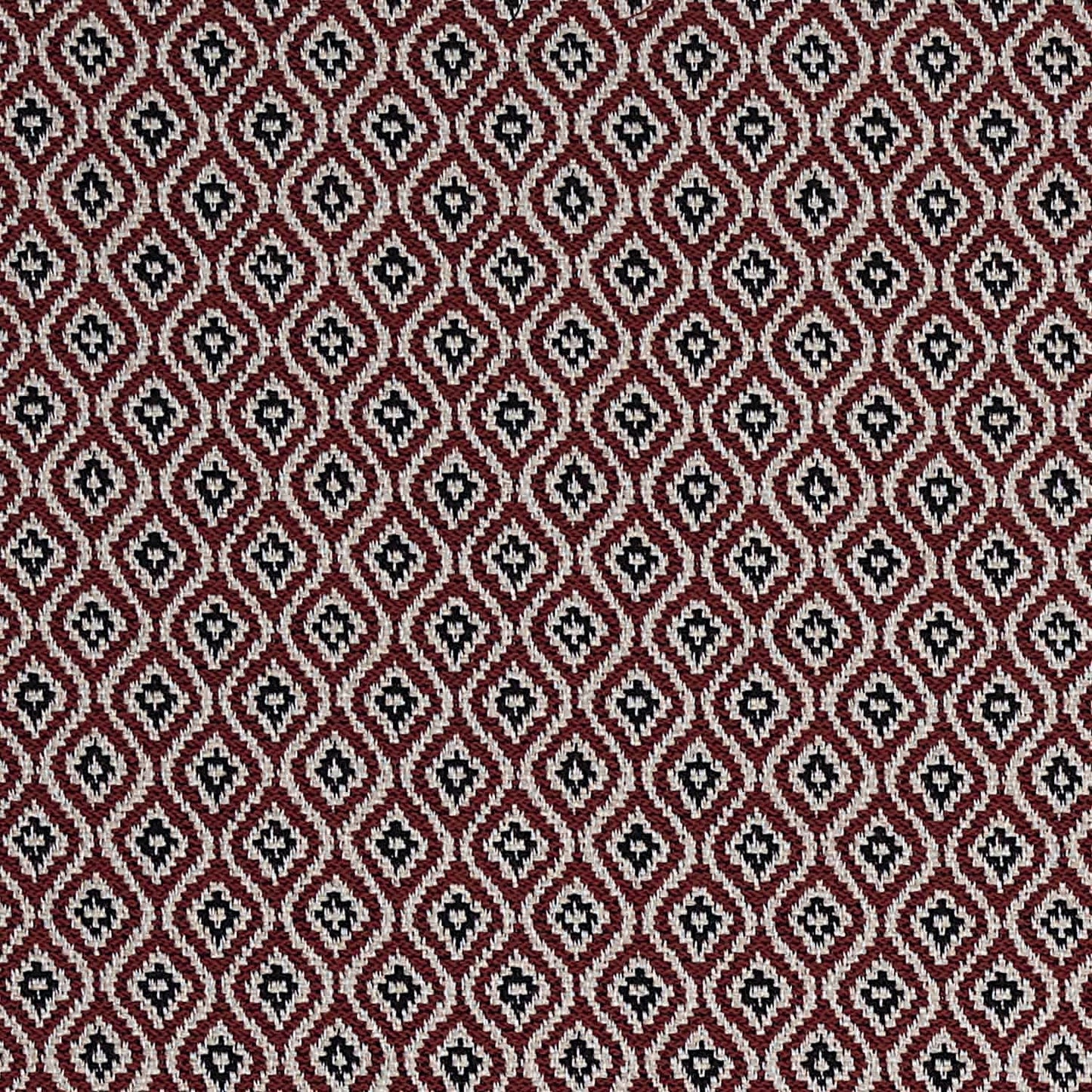 Patterned fabric with a geometric design on a red background