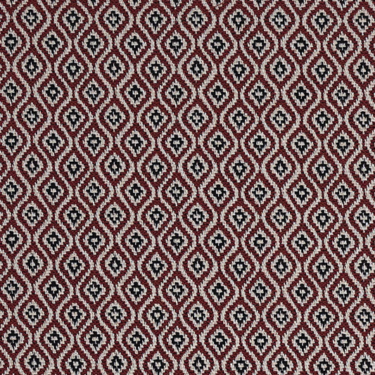 Patterned fabric with a geometric design on a red background