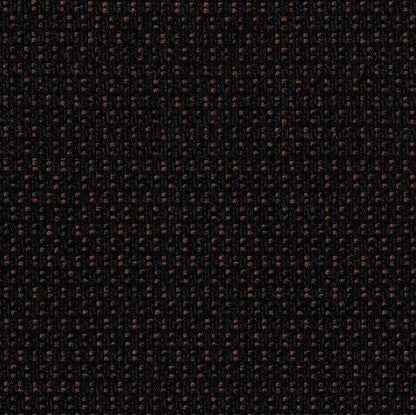 Close-up of a textured black fabric with small brown patterns