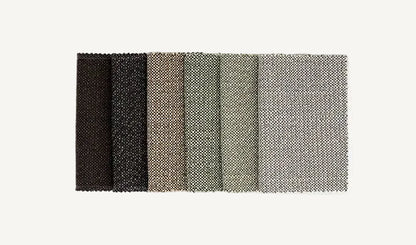 Color swatch with black, dark gray, light gray, and white textured fabric samples on a white background