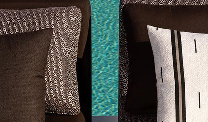 Close-up of patterned cushions on a chair with a pool in the background