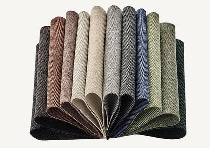 Set of fabric swatches in various colors arranged in a fan-like pattern on a light gray background.