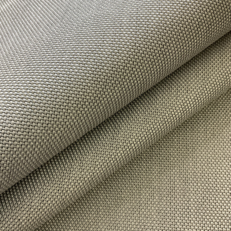 Close-up of textured beige fabric with a subtle pattern