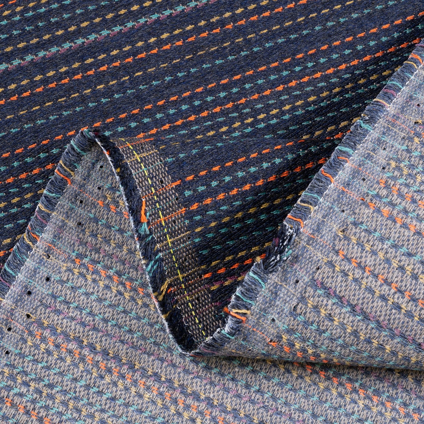 Close-up of textured fabric with multicolor pattern