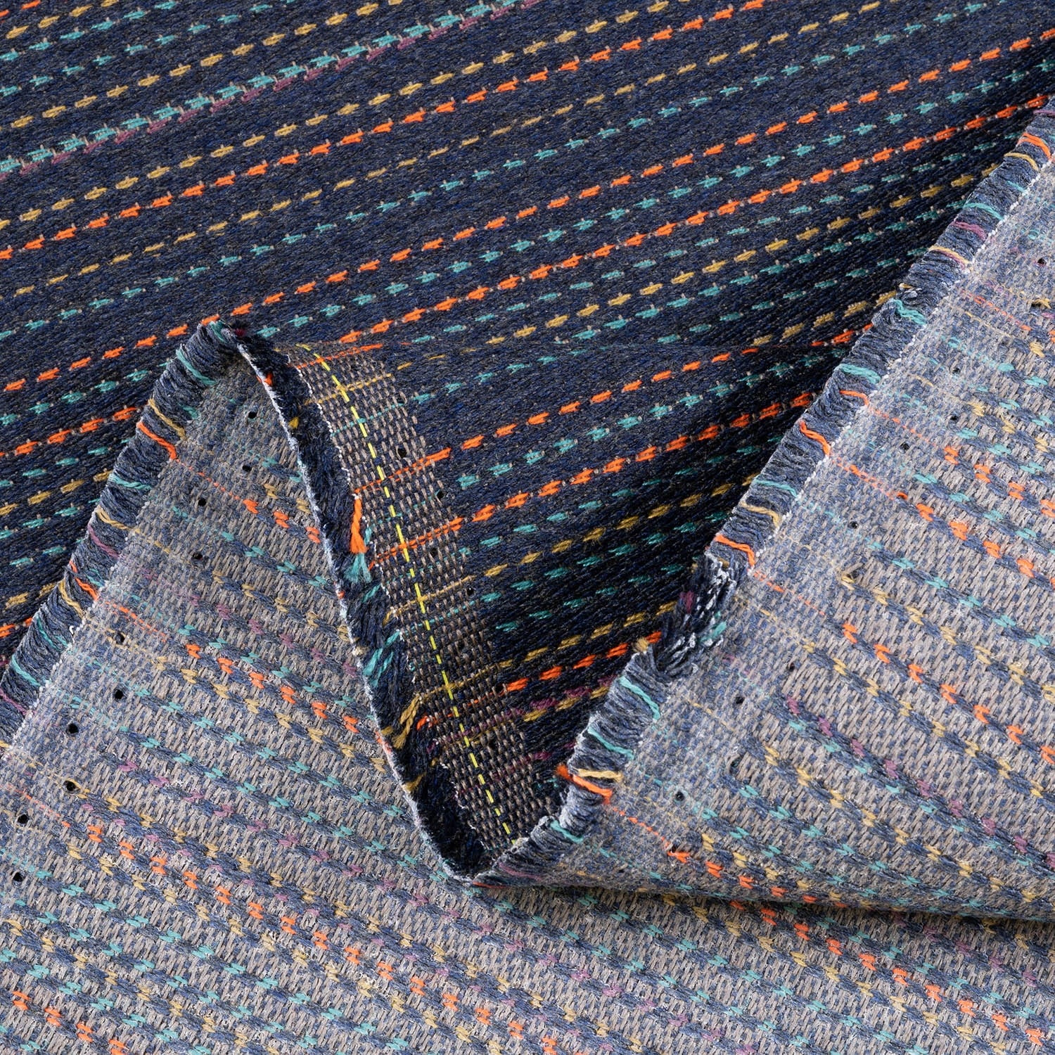 Close-up of textured fabric with multicolor pattern