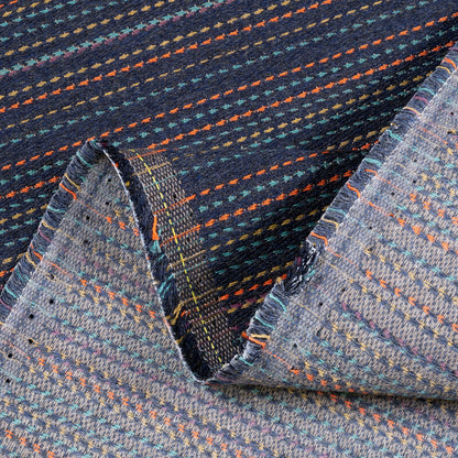 Close-up of textured fabric with multicolor pattern